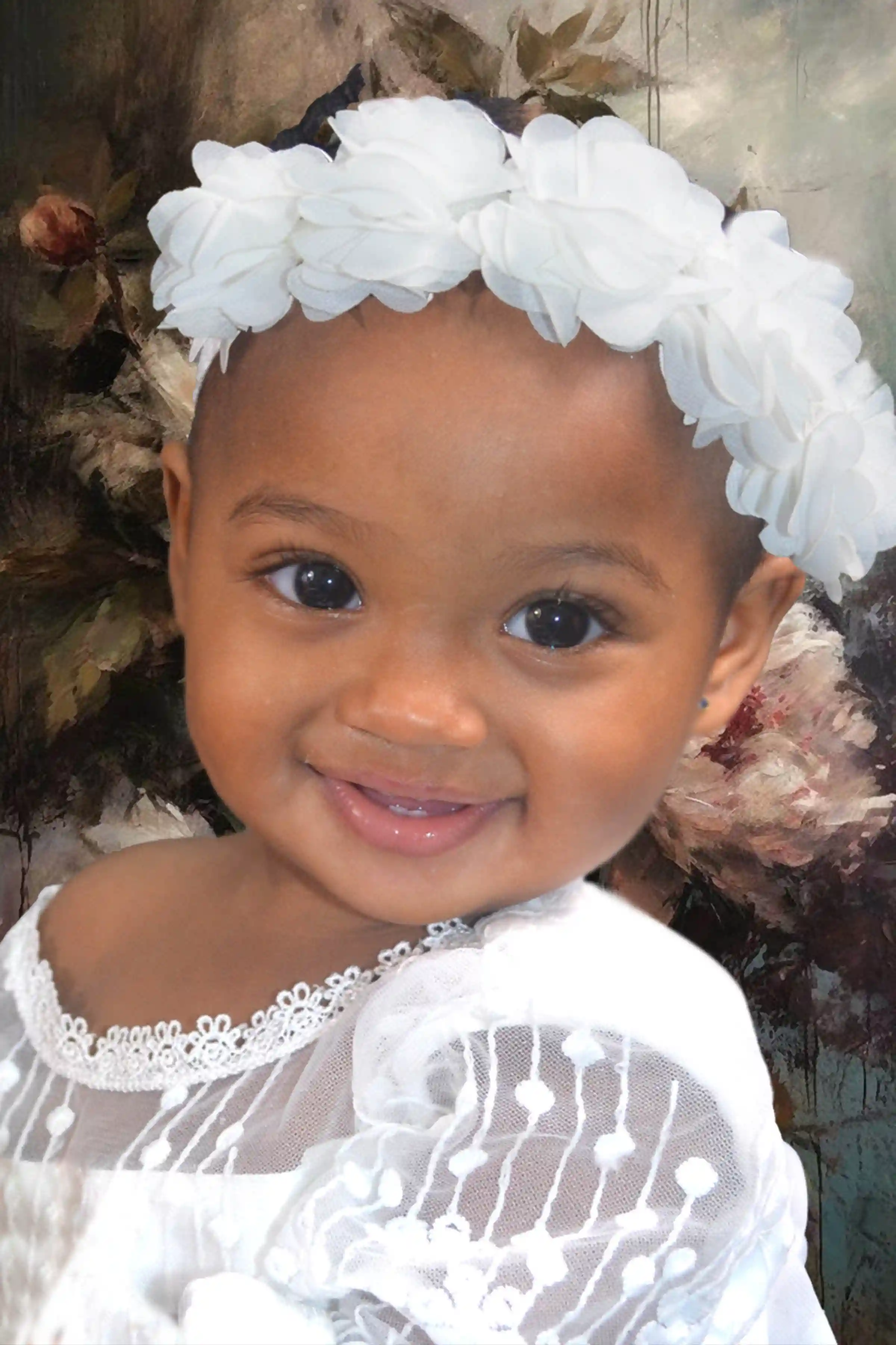 Foto niña flores blancas Tere Studio